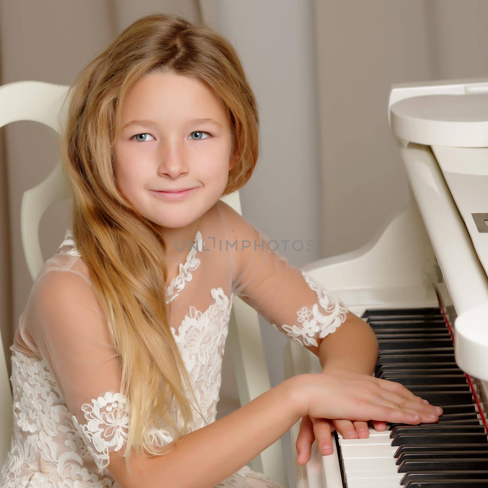 The girl is at the white grand piano. by kolesnikov_studio