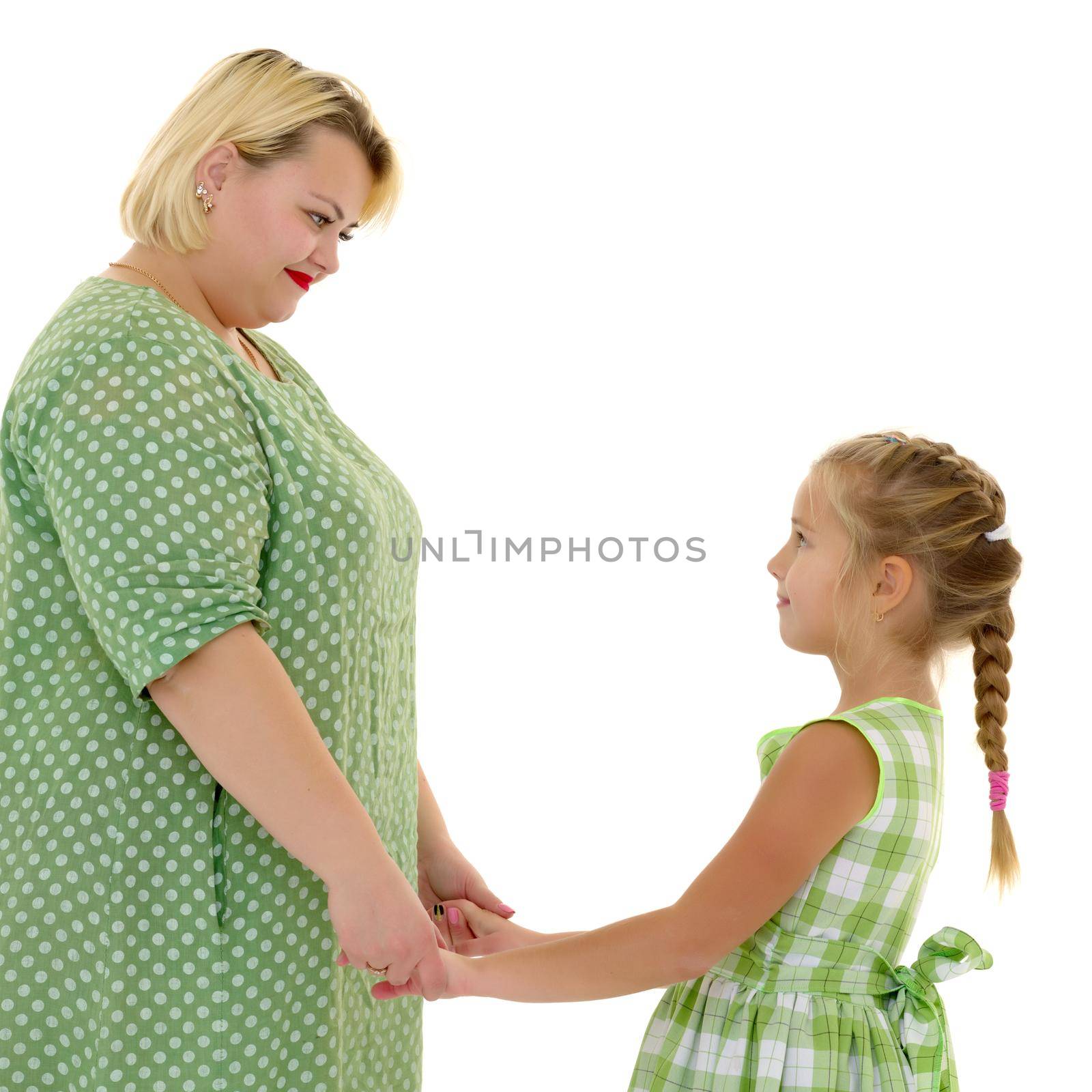 Mom and daughter hold hands. by kolesnikov_studio