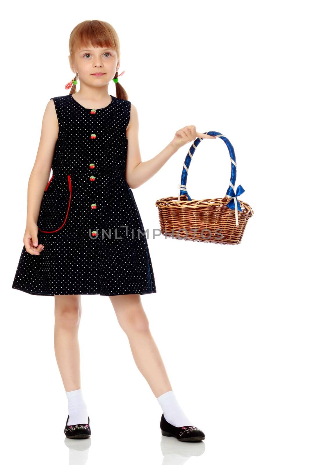 A little girl with a wicker basket made of willow twigs. The concept of family rest, harvesting, picking mushrooms and berries. Isolated over white background