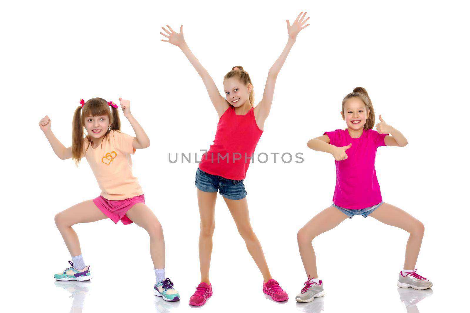A group of cheerful, emotional children keep their thumbs up. The concept of advertising, sports and fitness. Isolated on white background.