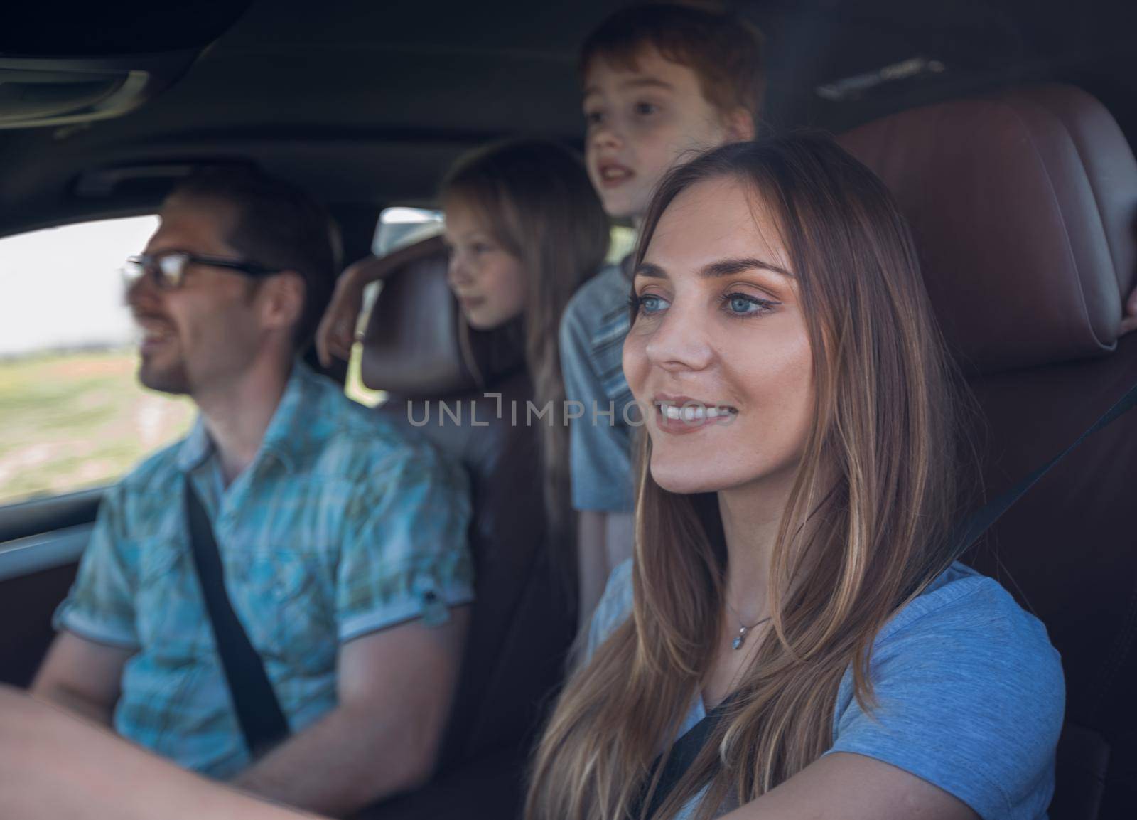 close up. the young woman behind the wheel of the family car by asdf