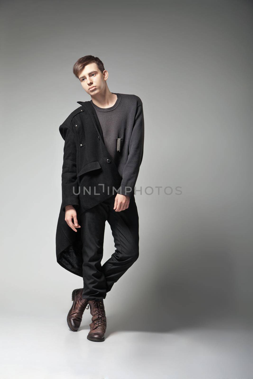 Fashion Shot of a young man in coat by Julenochek