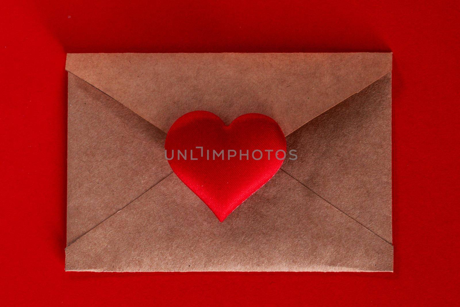 Valentine day love letter of brown paper envelope with red heart