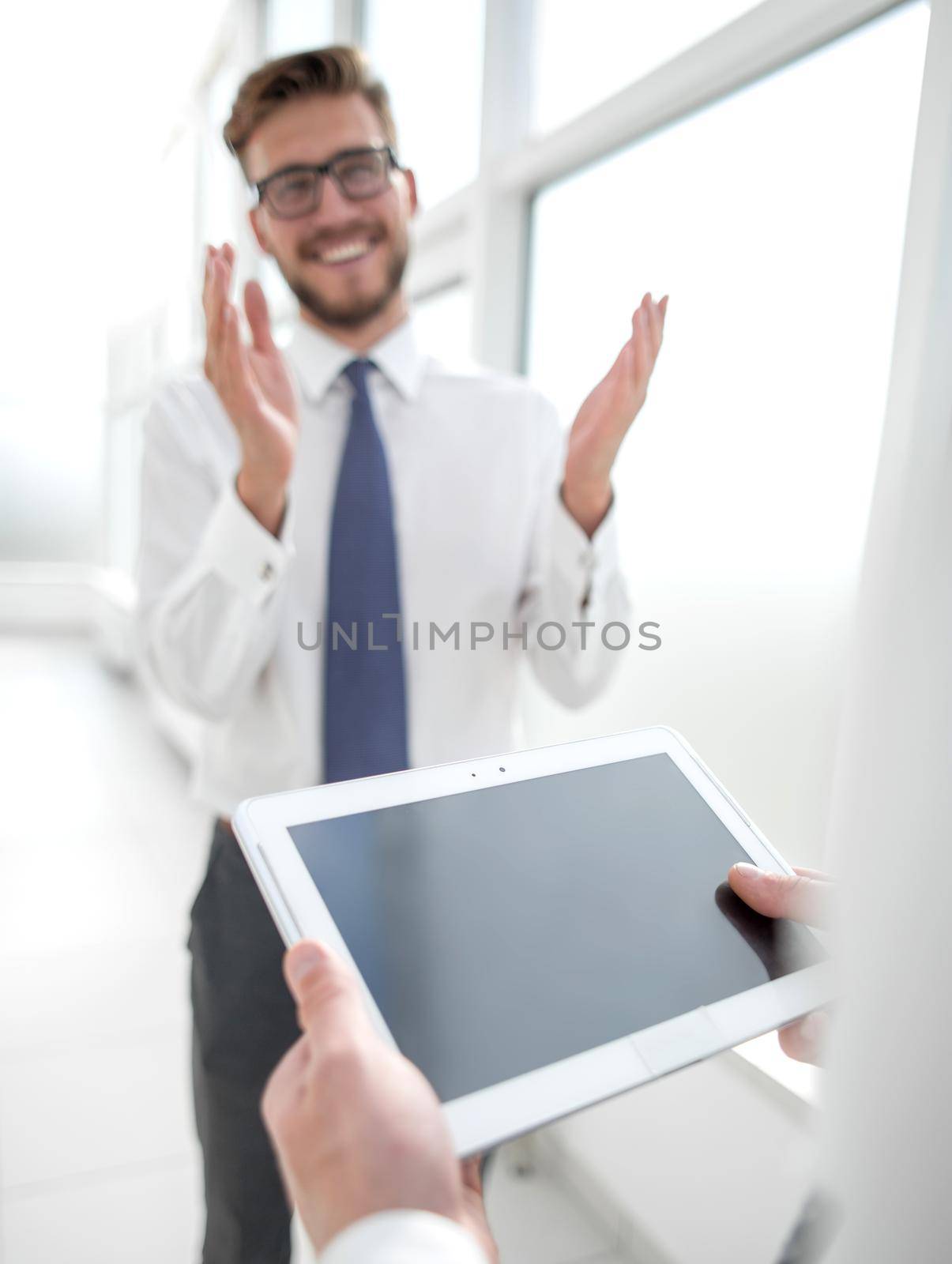 close up.businessman with digital tablet on office background.business and technology
