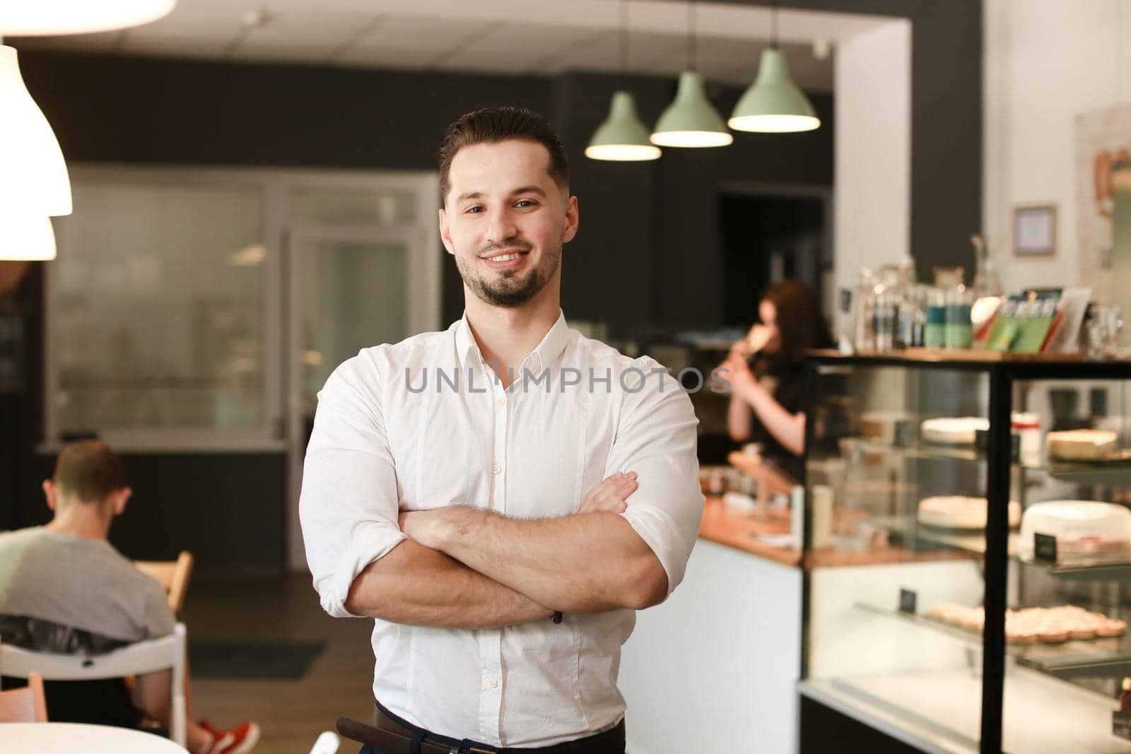 Young caucasian businessman standing with at cafe. by sisterspro