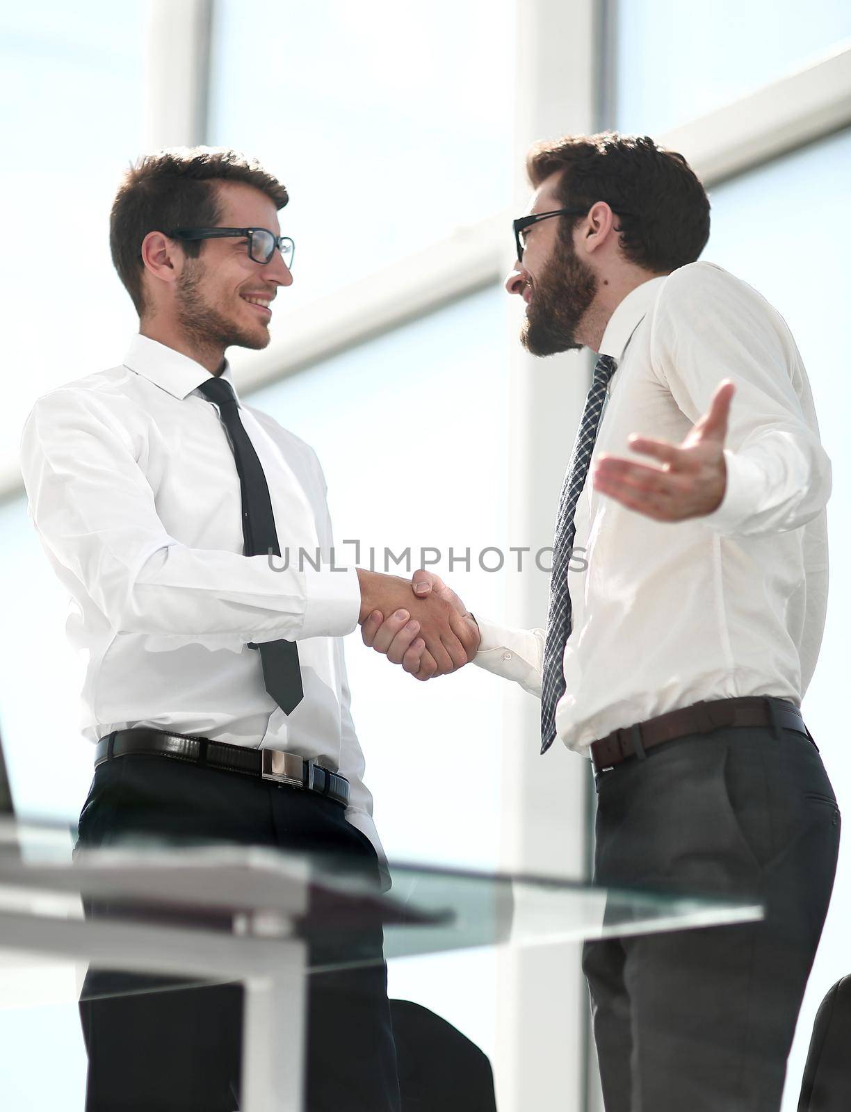 business people shaking hands with each other by asdf