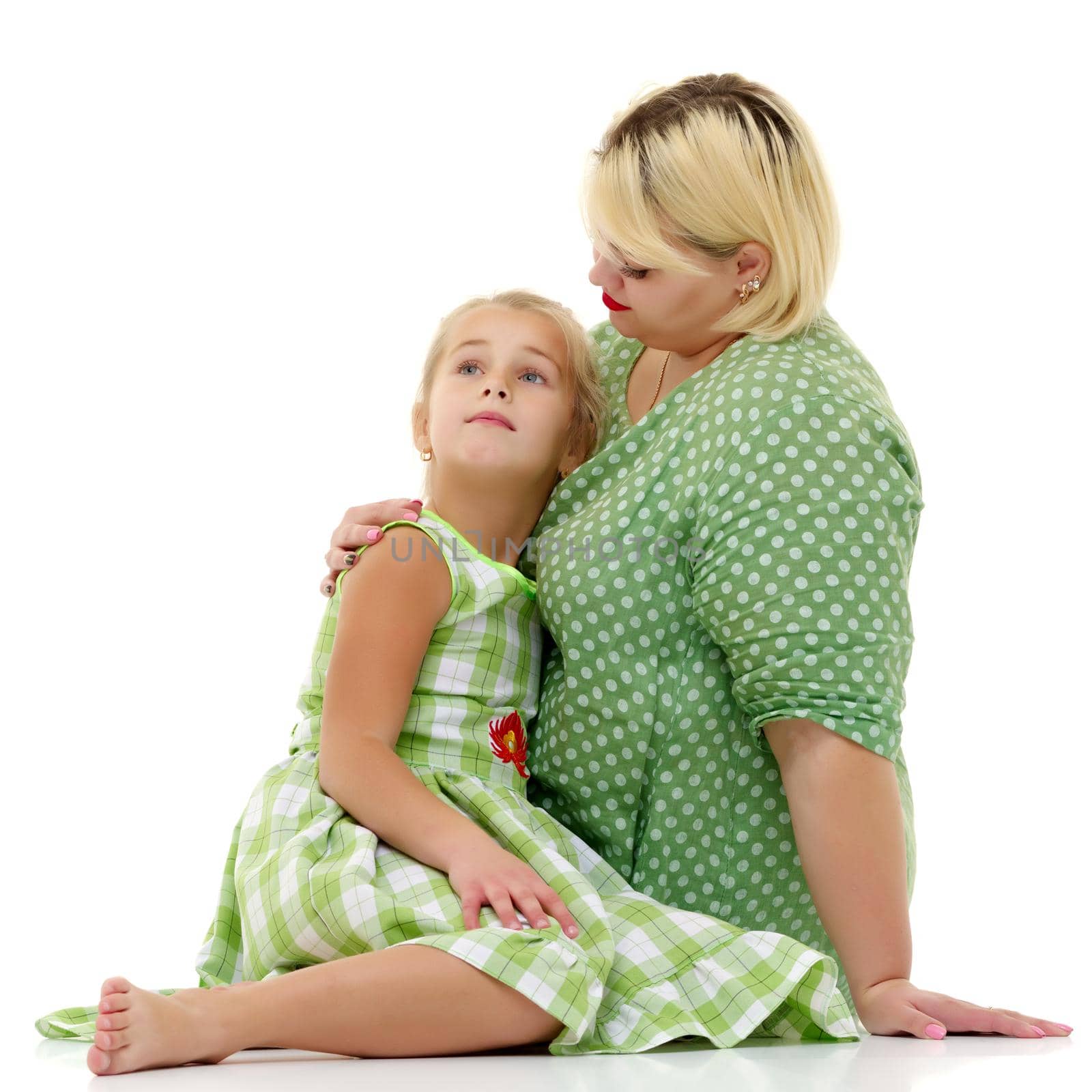 Happy family mom and little daughter, studio portrait on white background.Isolated.