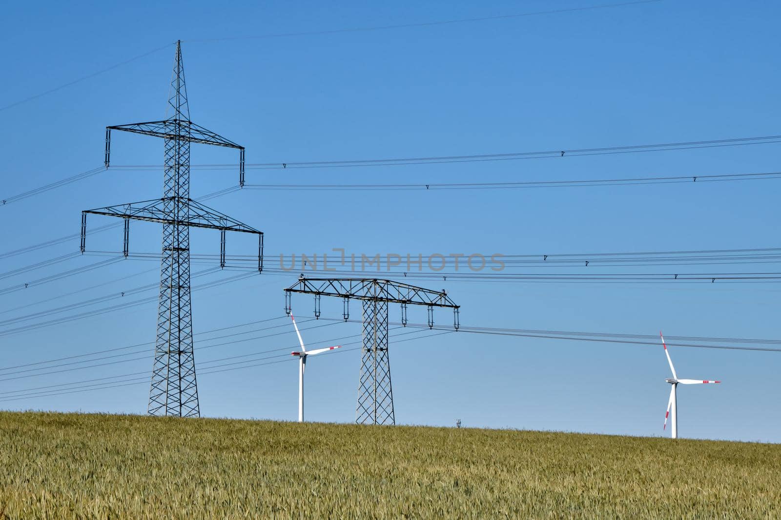 Power lines and wind turbines seen in rural Germany