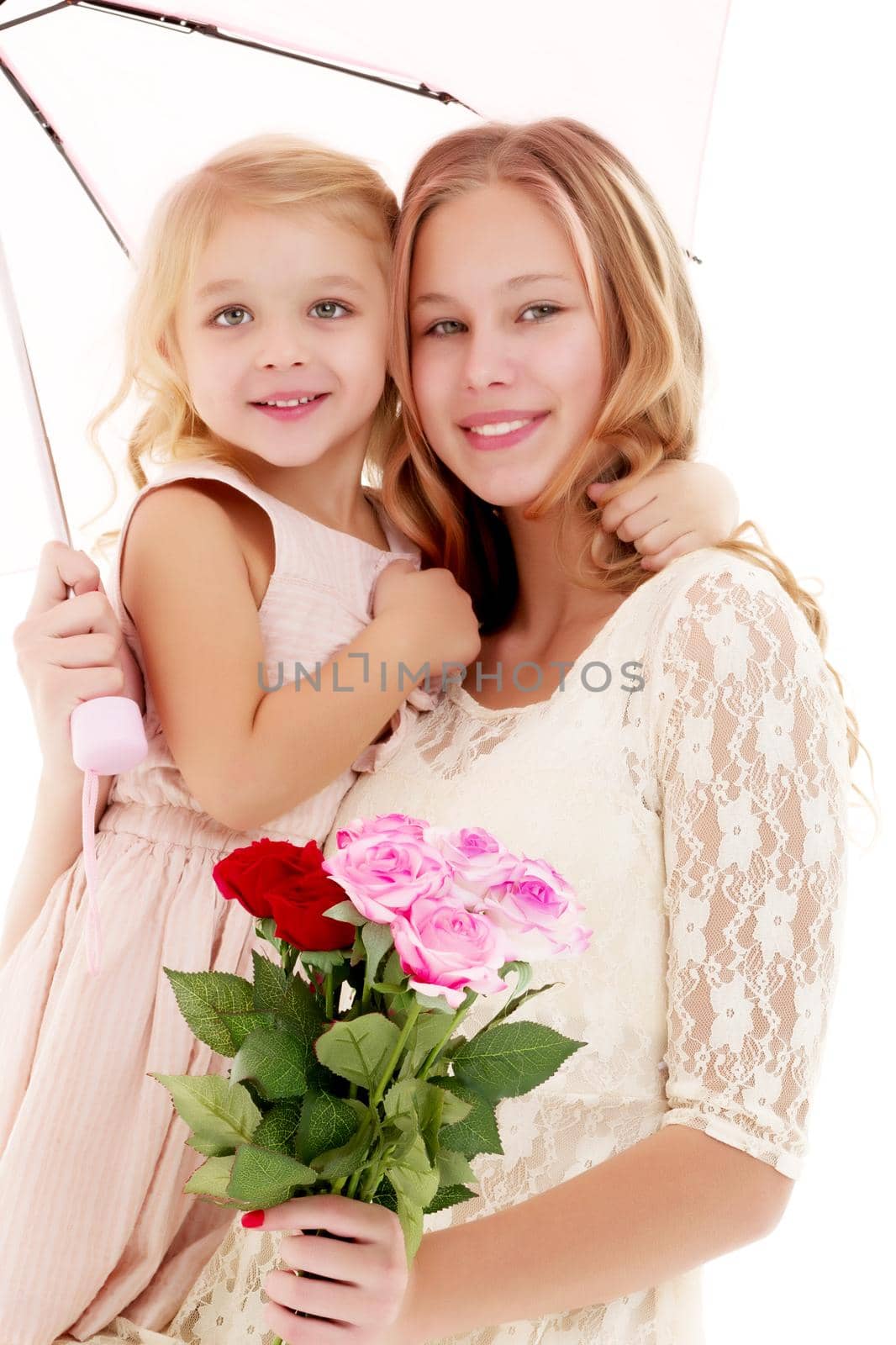 Two little girls with flowers. by kolesnikov_studio
