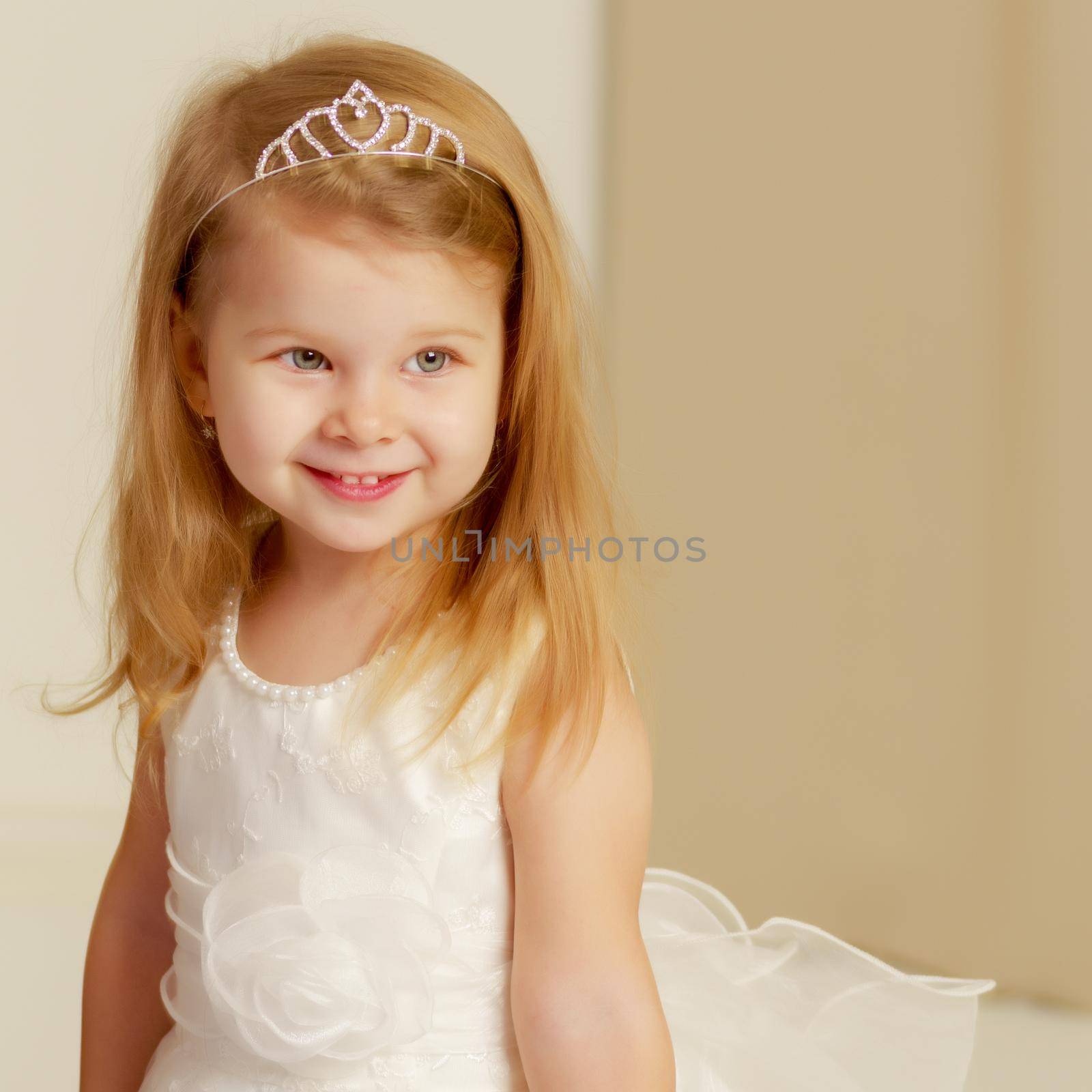 Beautiful little girl close-up. The concept of beauty and fashion, happy childhood. Isolated on white background.