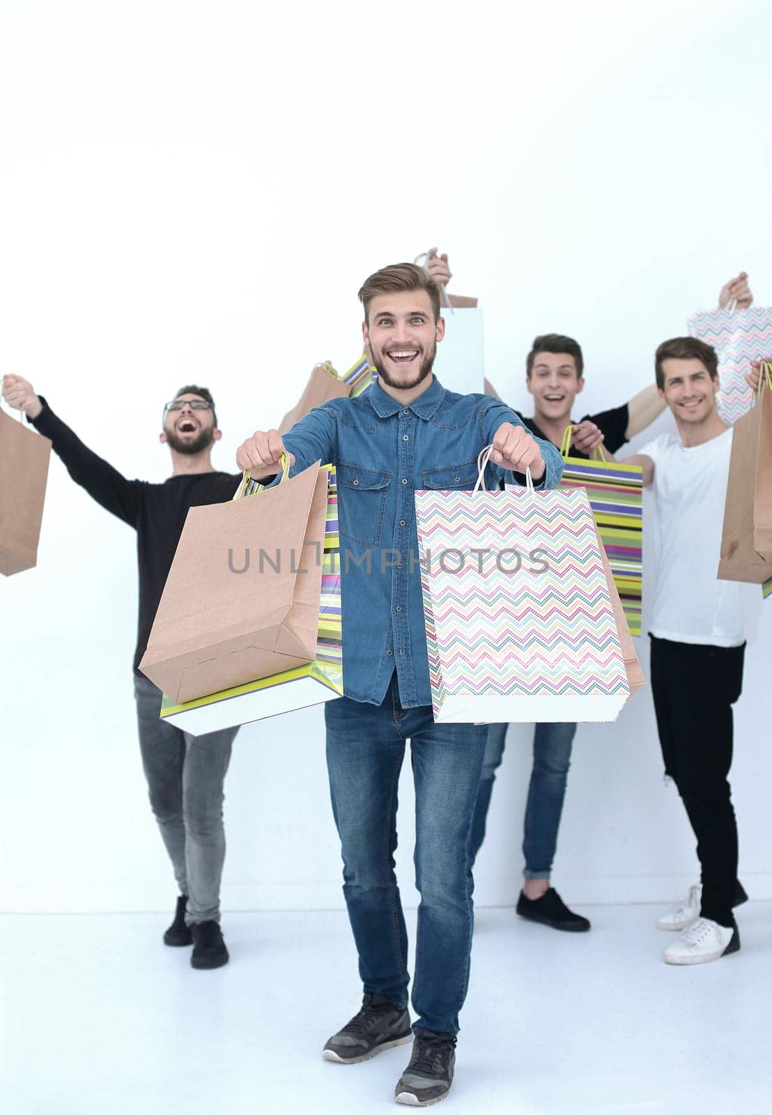 group of cheerful young people with shopping bags.photo with text space