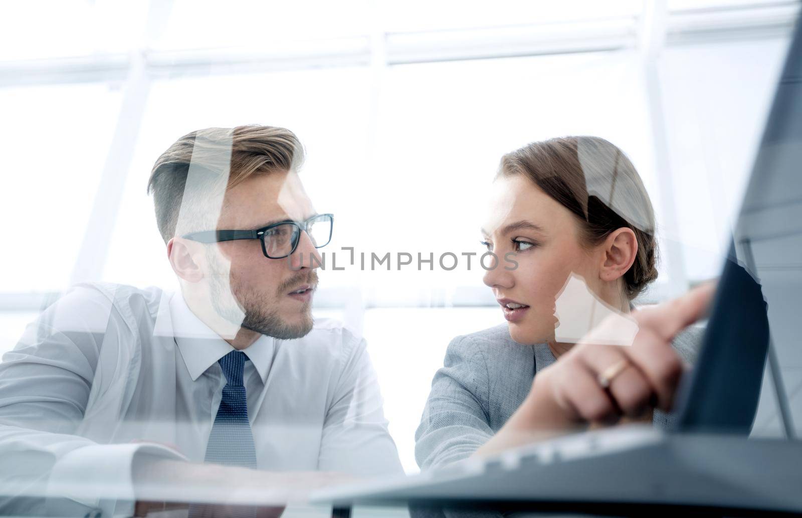 business couple discussing data on a laptop screen.photo with copy space