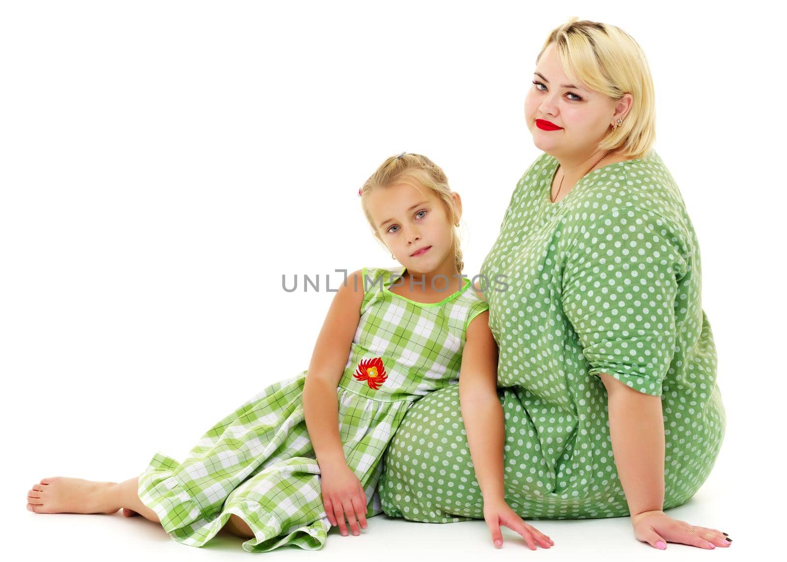 Happy family mom and little daughter, studio portrait on white background.Isolated.