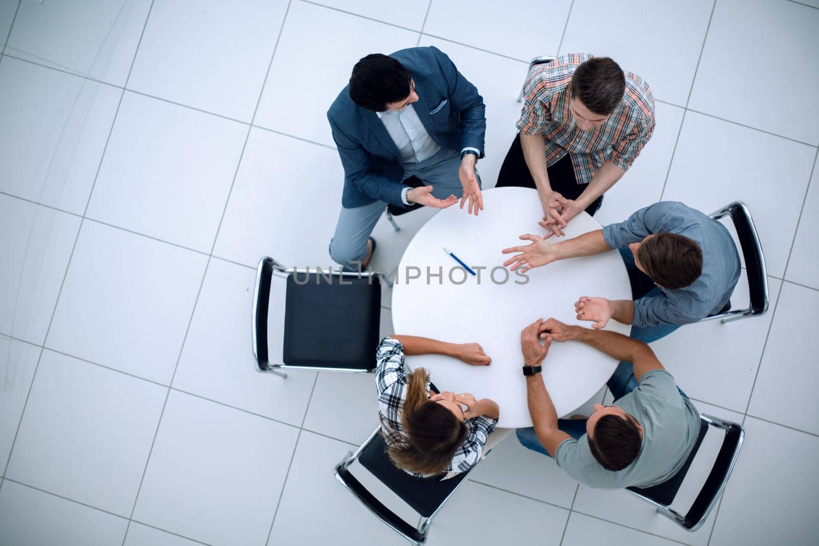 top view.Manager and creative team sitting at the round table.photo with copy space