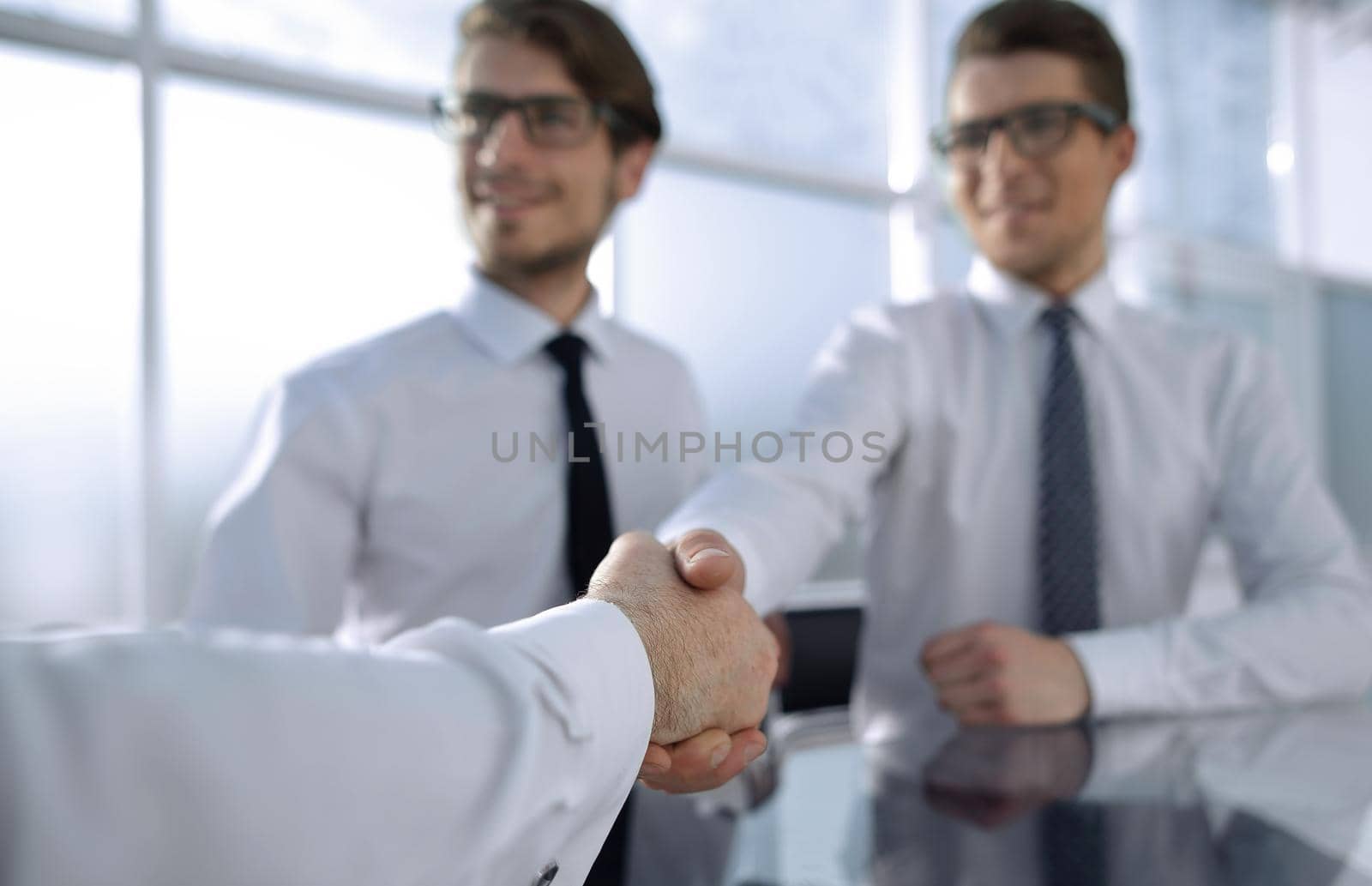 background image of a handshake of business people.business background