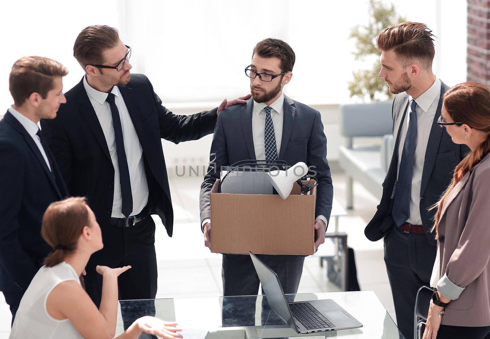 business team and frustrated employee with personal things.the concept of dismissal