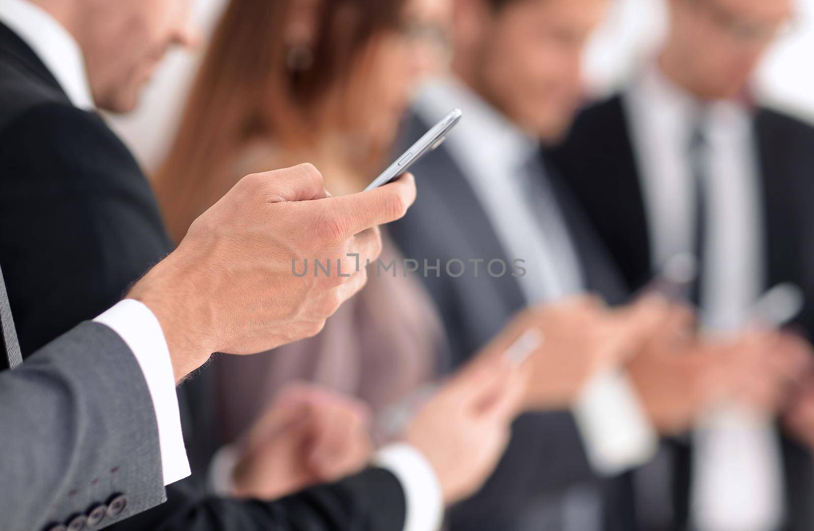 businessman using touch screen smart phone hands close up