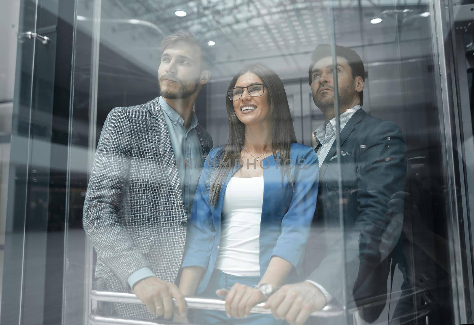 Business team group going on elevator.business concept