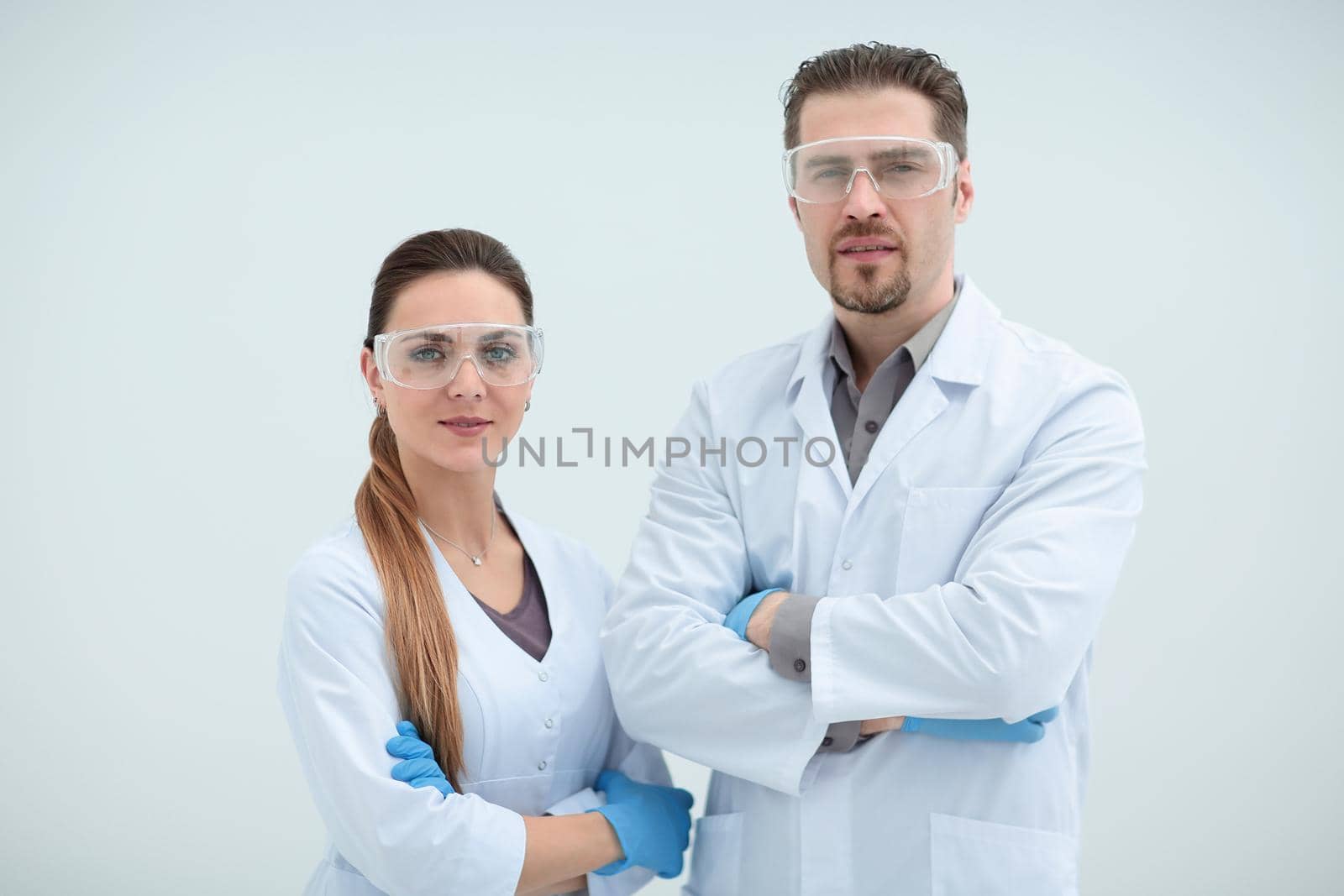 portrait of two scientists biologists on a light background