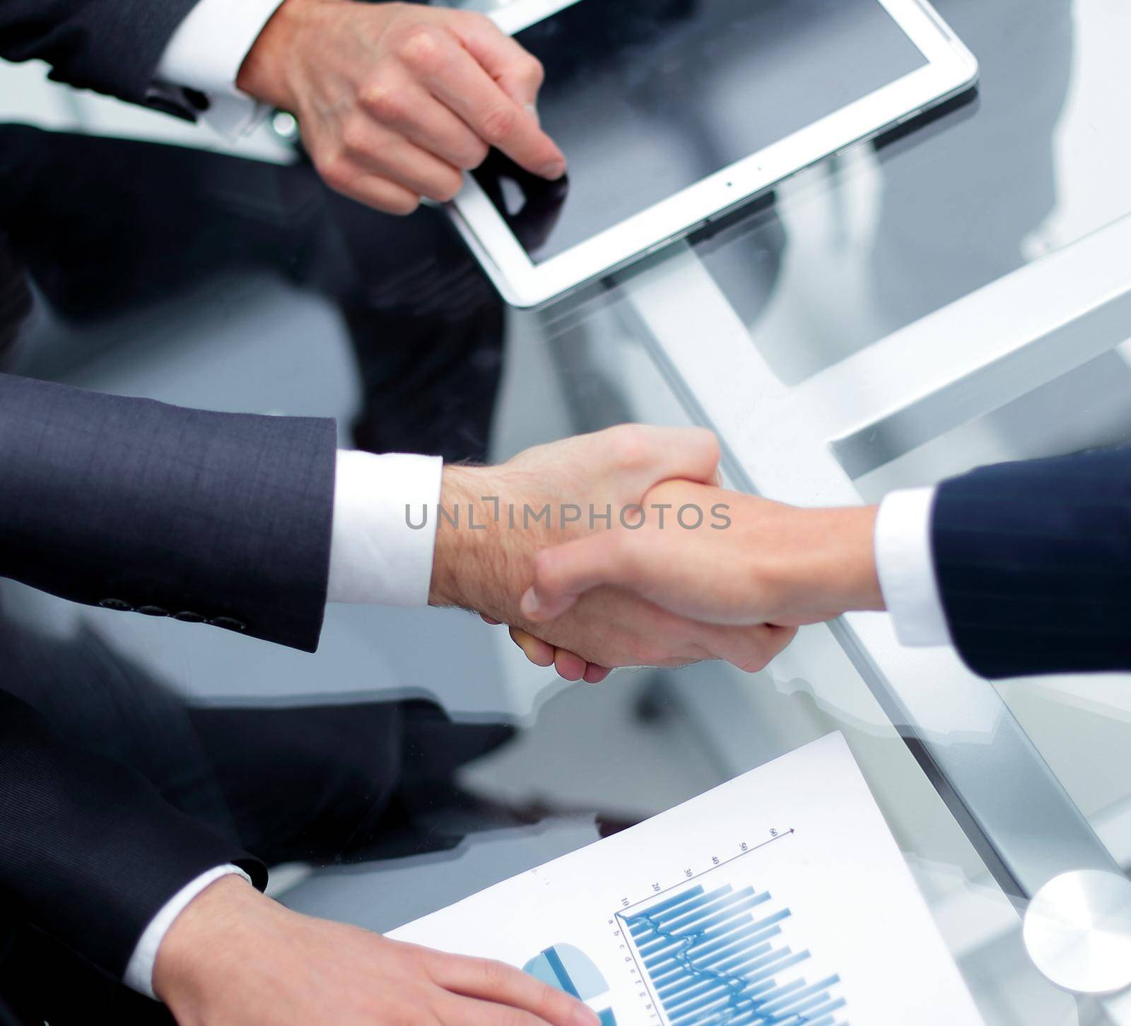 close up. investor and businessman shaking hands.