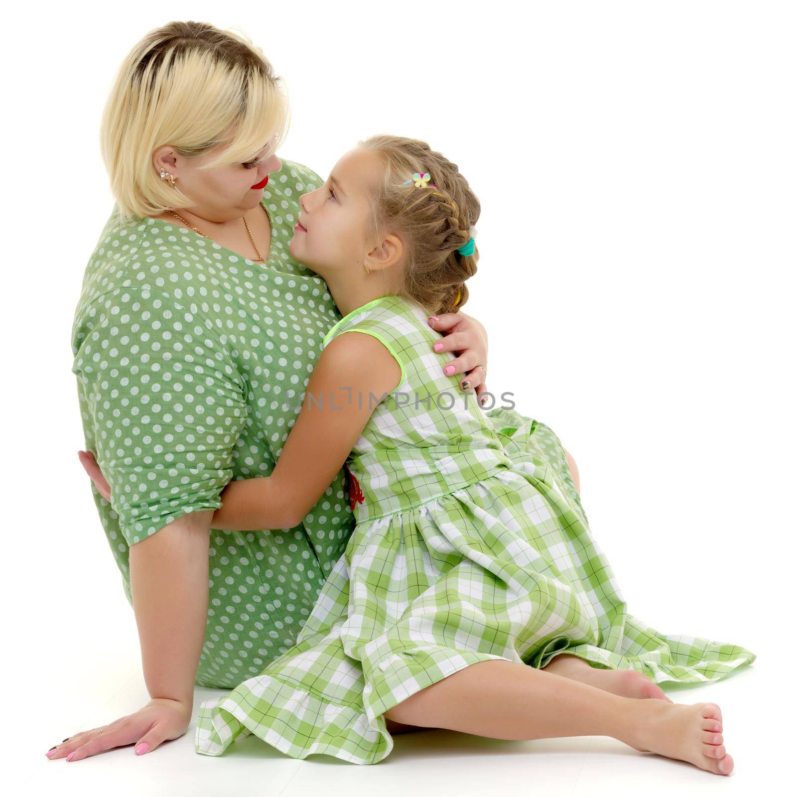 Happy family mom and little daughter, studio portrait on white background.Isolated.