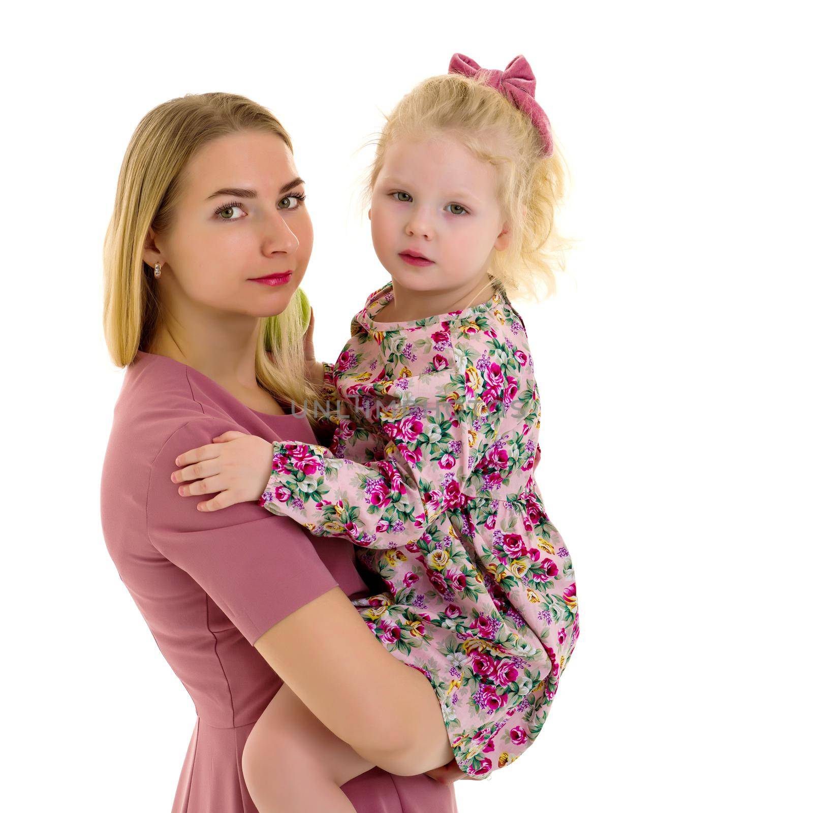 Happy family mom and little daughter, studio portrait on white background.Isolated.