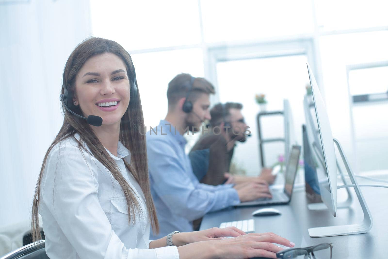 background image of the call center employee in the workplace