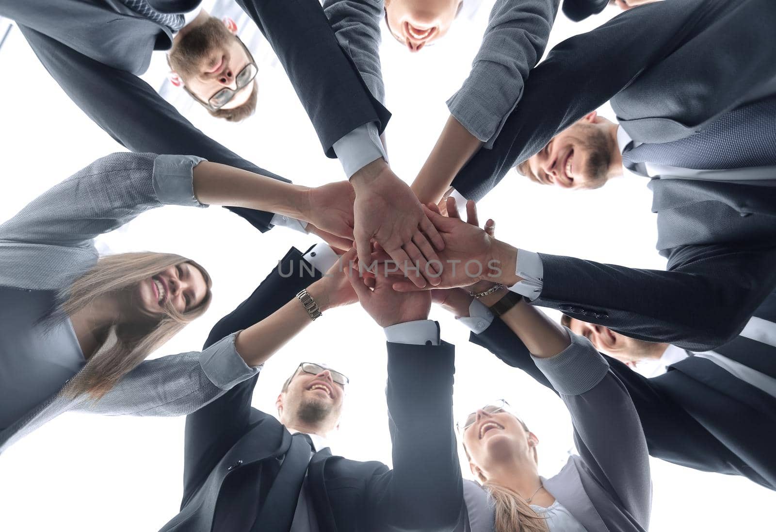 bottom view.the business team is making a tower out of hand.the concept of teamwork