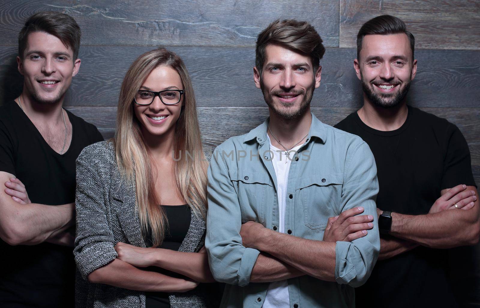 a group of young people stand and smile by asdf