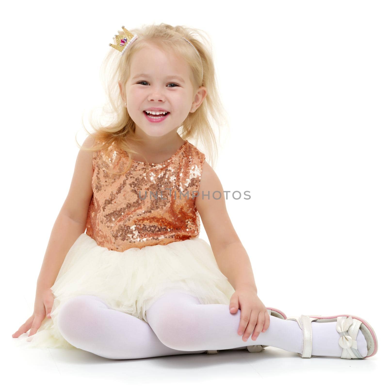 Beautiful little girl laughing. The concept of a happy childhood, emotions. Isolated on white background.