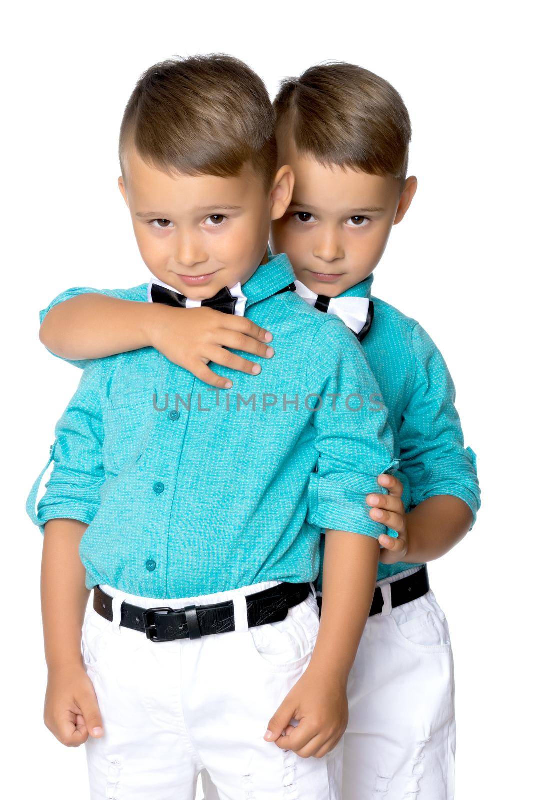 Two little brothers of Gemini together are sad. Isolated on white background