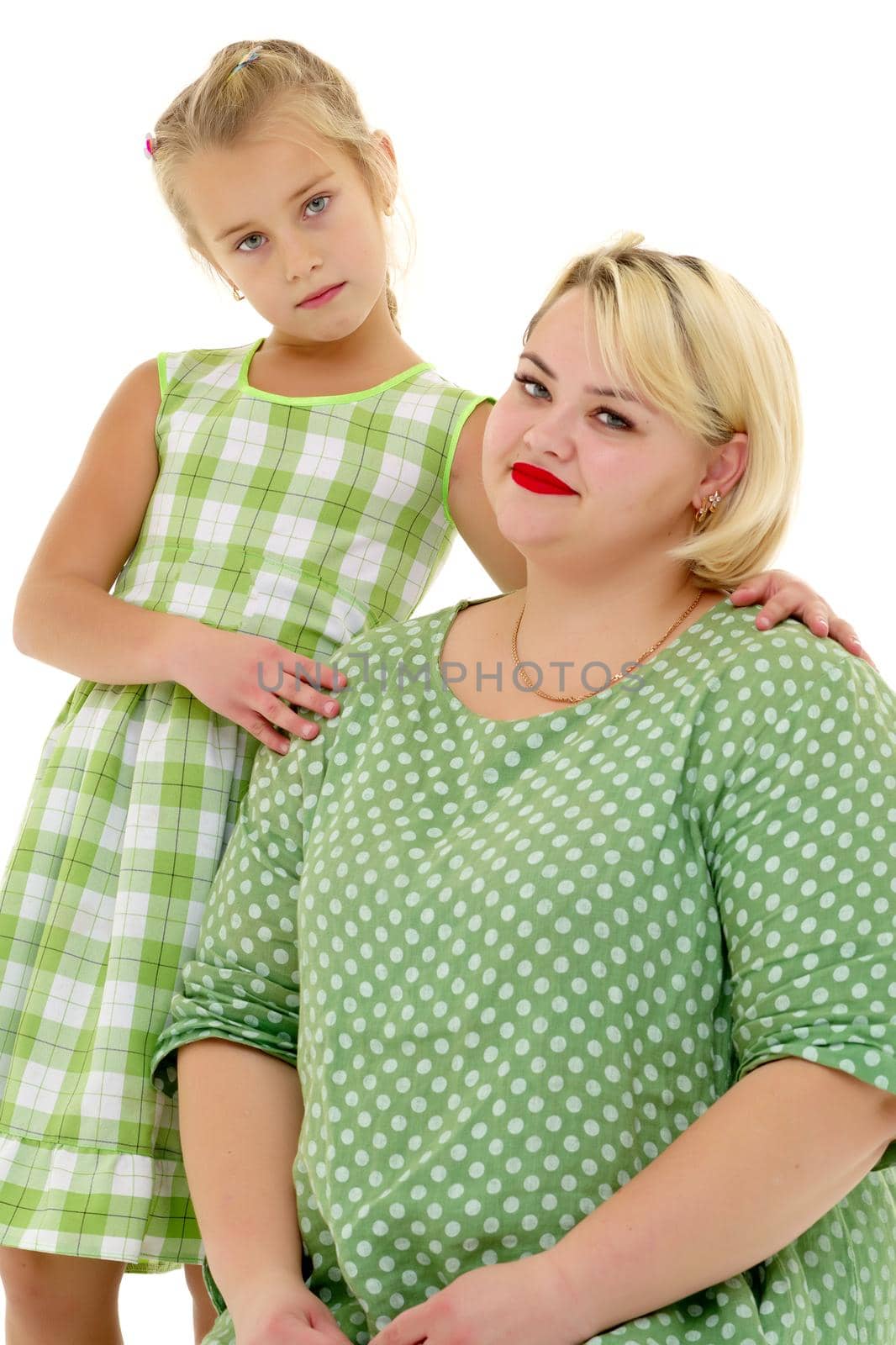 Happy family mom and little daughter, studio portrait on white background.Isolated.