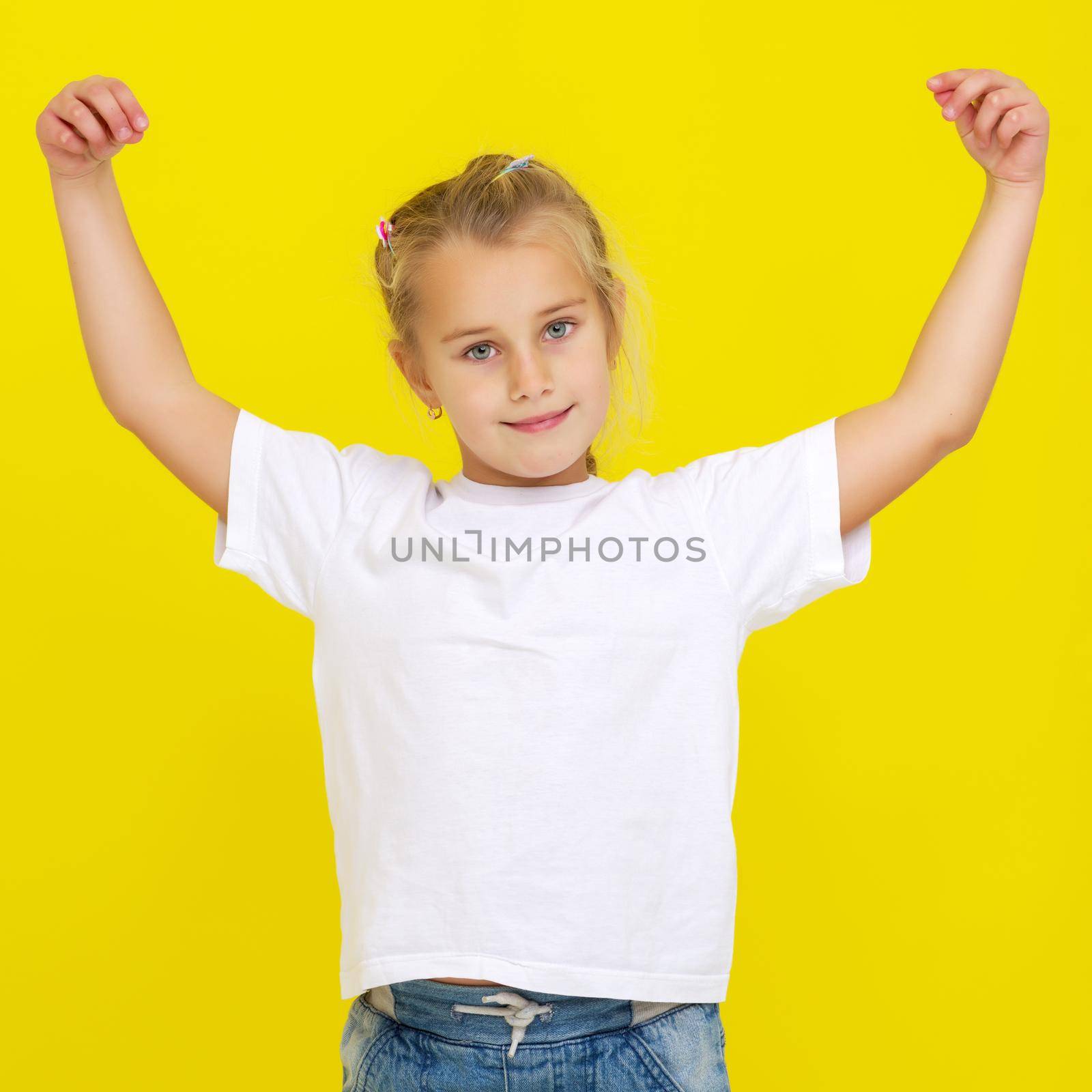 Emotional little girl in a clean white T-shirt. by kolesnikov_studio