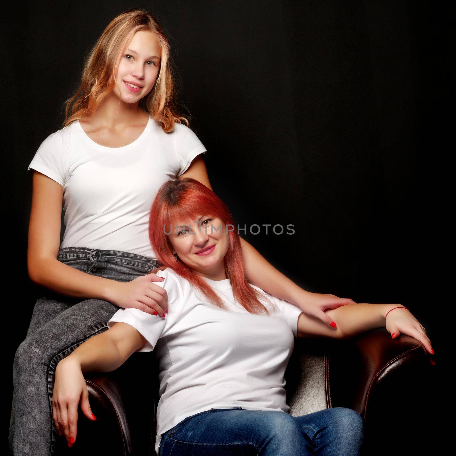 mother and little daughter gently embrace by kolesnikov_studio