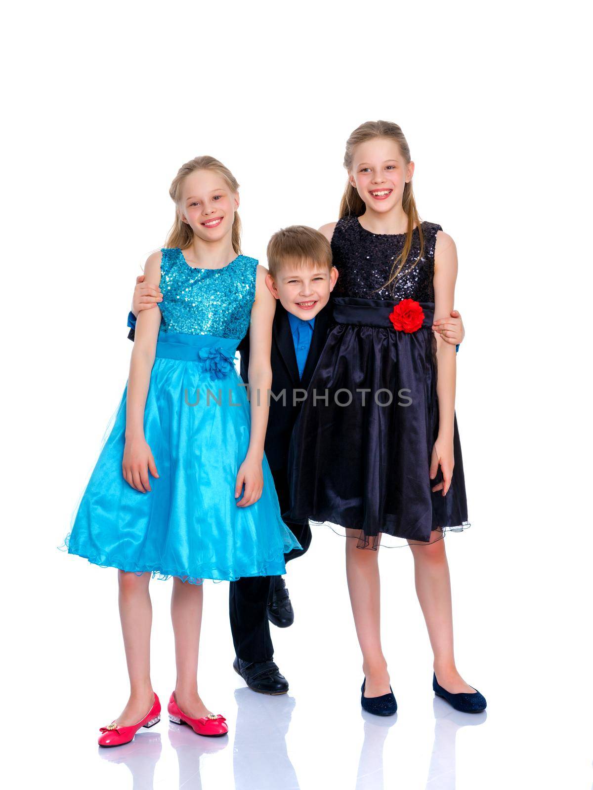 Group of happy little children posing in studio. The concept of a happy childhood, friendship.