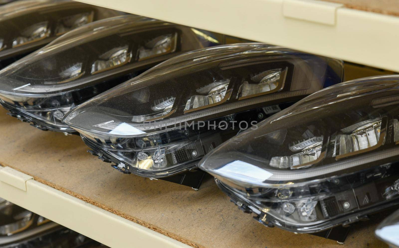 Row of the car headlights at the factory