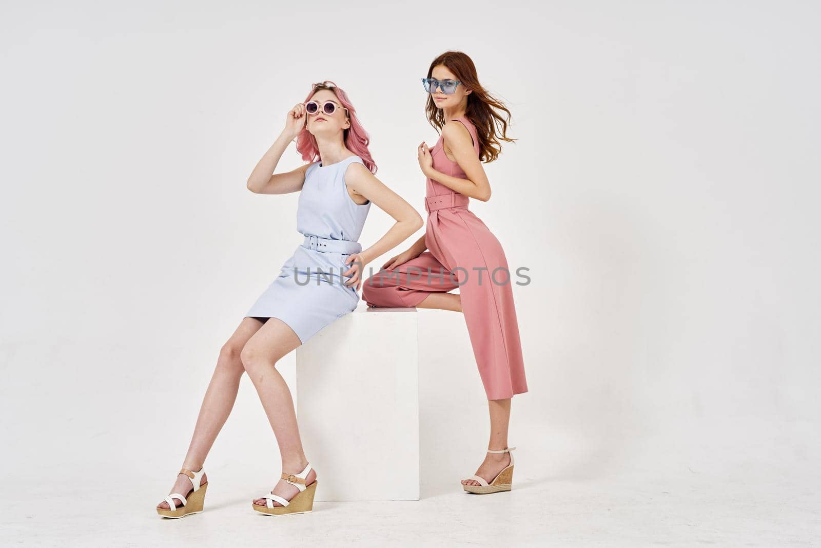 two girlfriends standing side by side posing fashion luxury by Vichizh