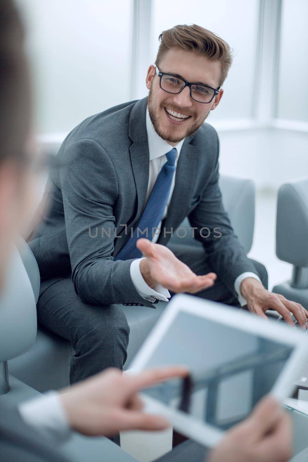 close up.businessman in the workplace in the office. new technology concept