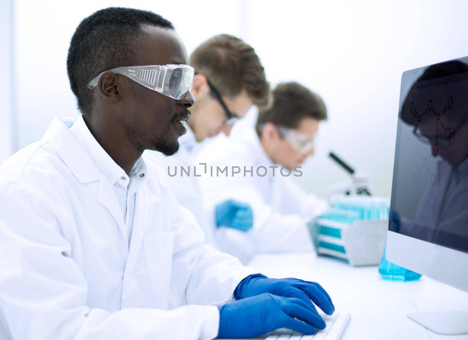 head of the research center sitting at his Desk by asdf