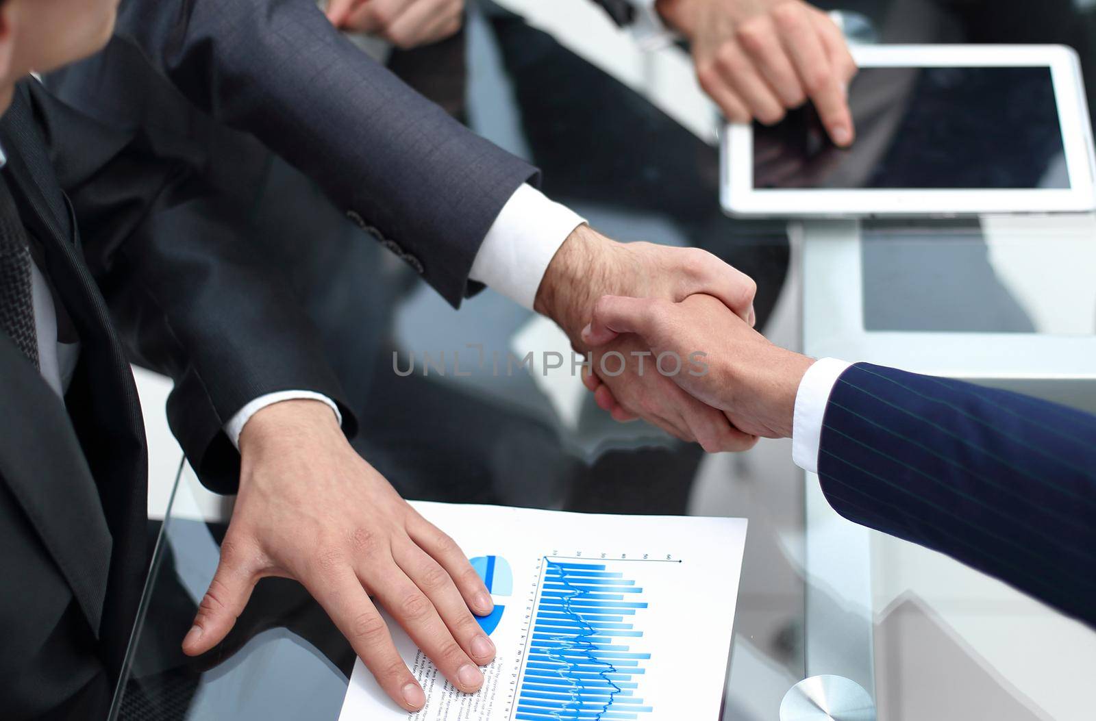 close up. investor and businessman shaking hands.