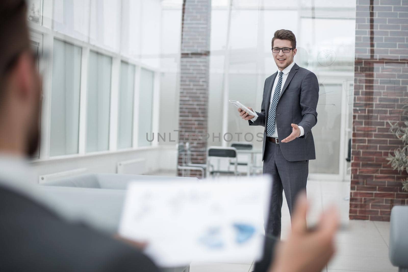businessman discussing standing in the office. photo with copy space