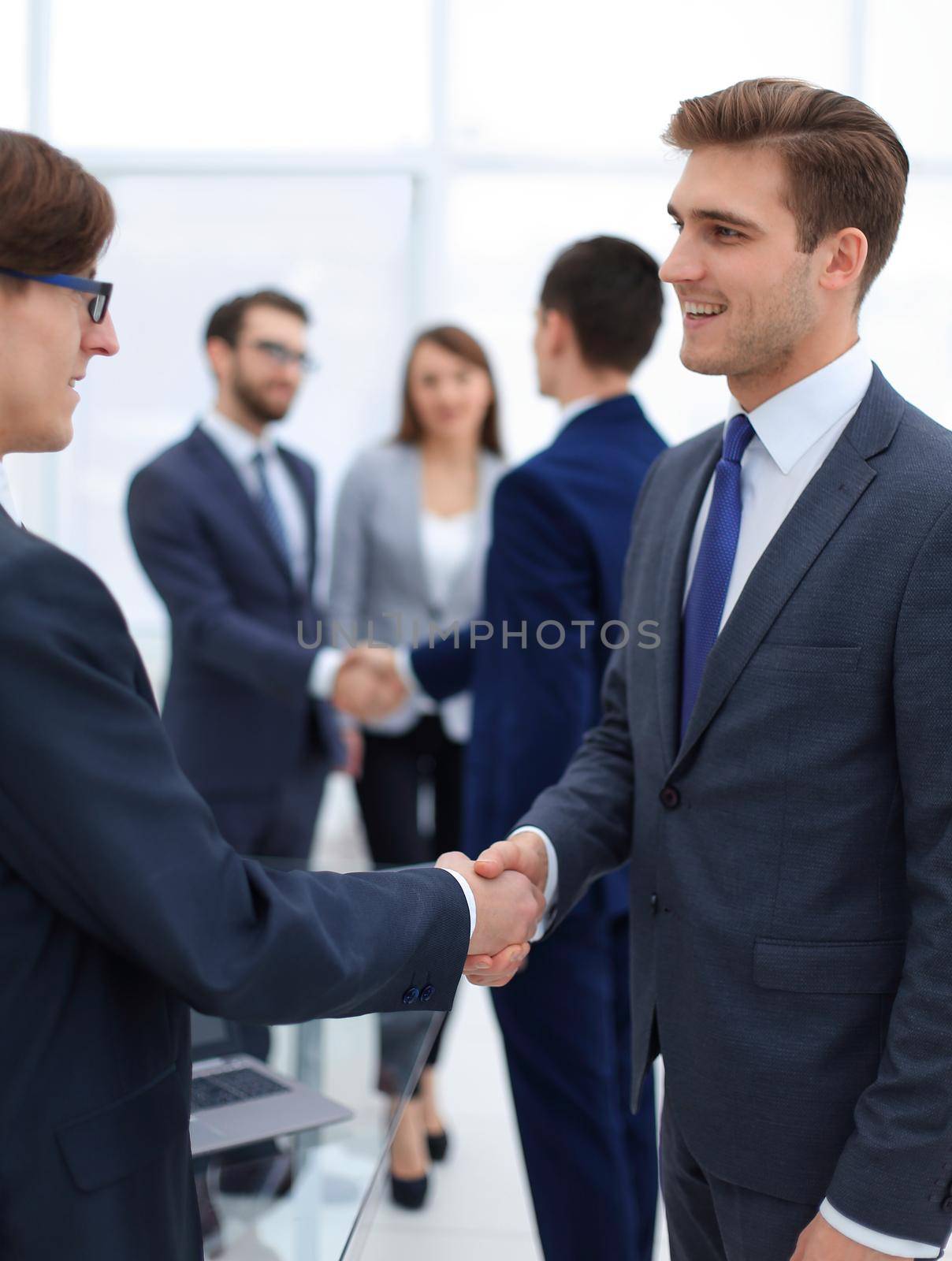 handshake of business partners after the briefing.