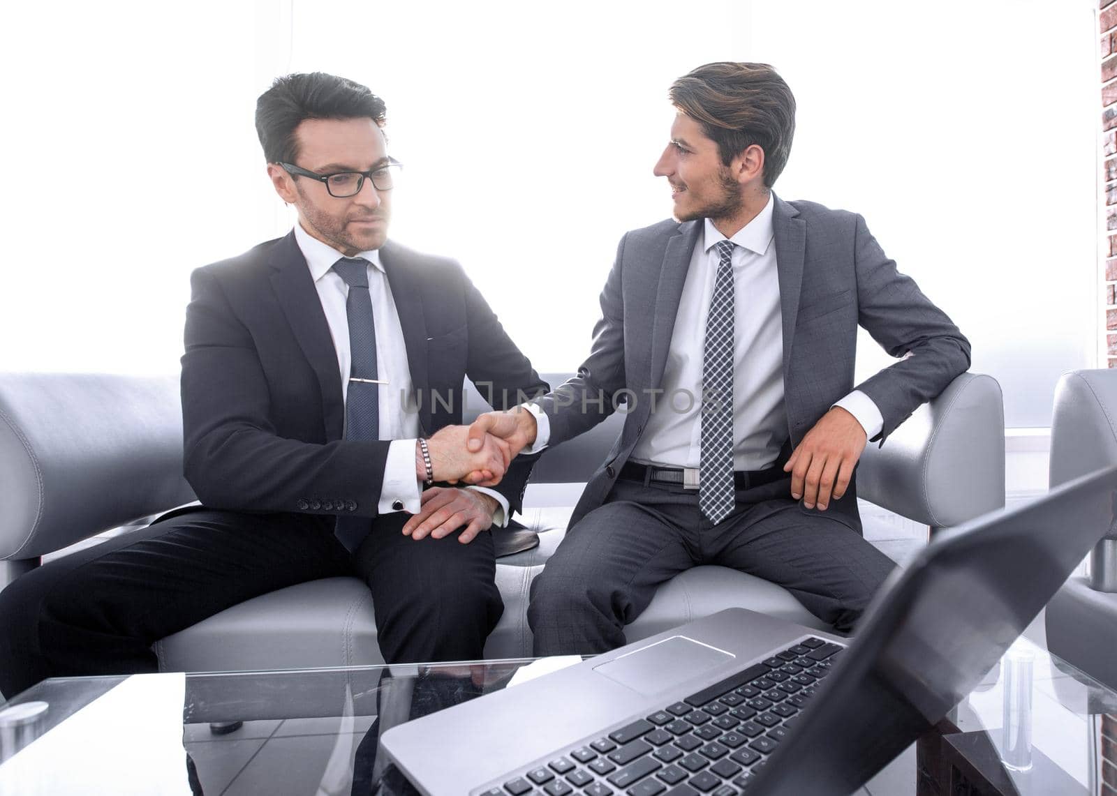 handshake of business partners at the meeting in the business center.business concept