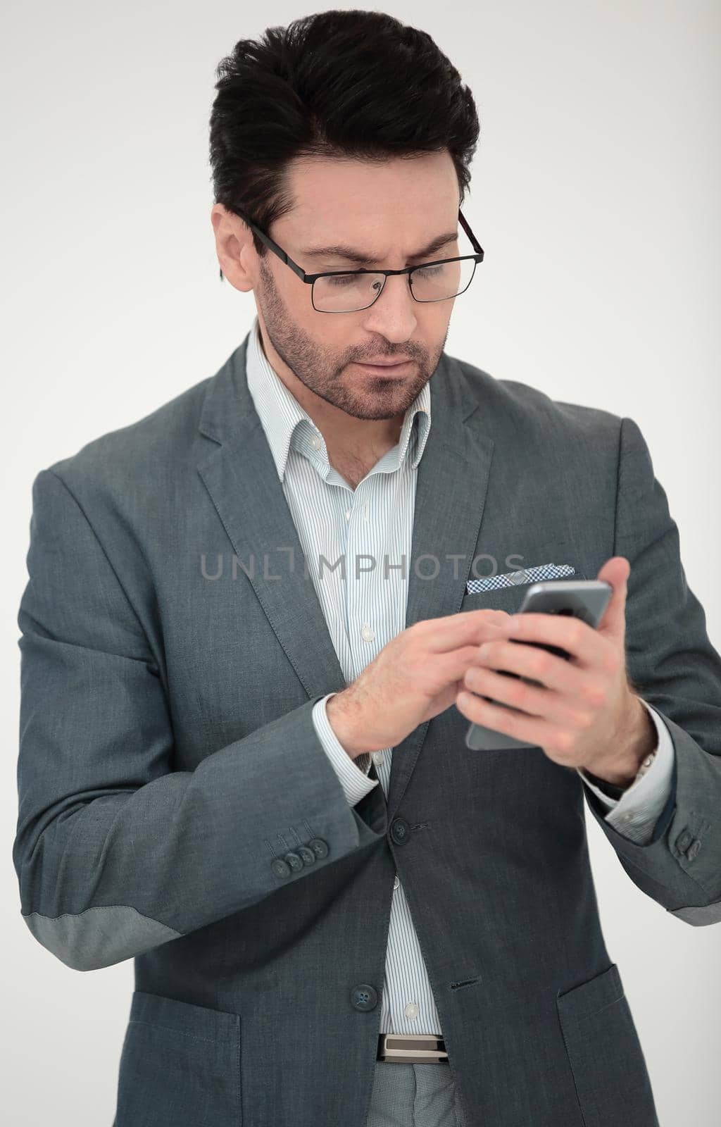 close up. business man reading an SMS on his smartphone.people and technology