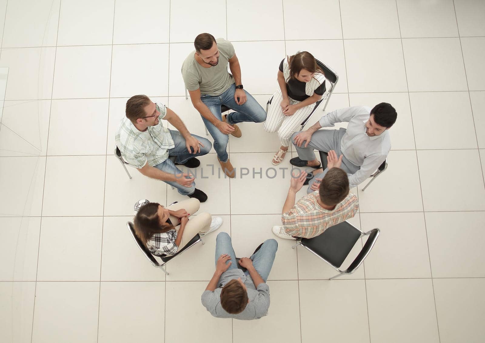 top view.business team discussing current issues.the concept of teamwork