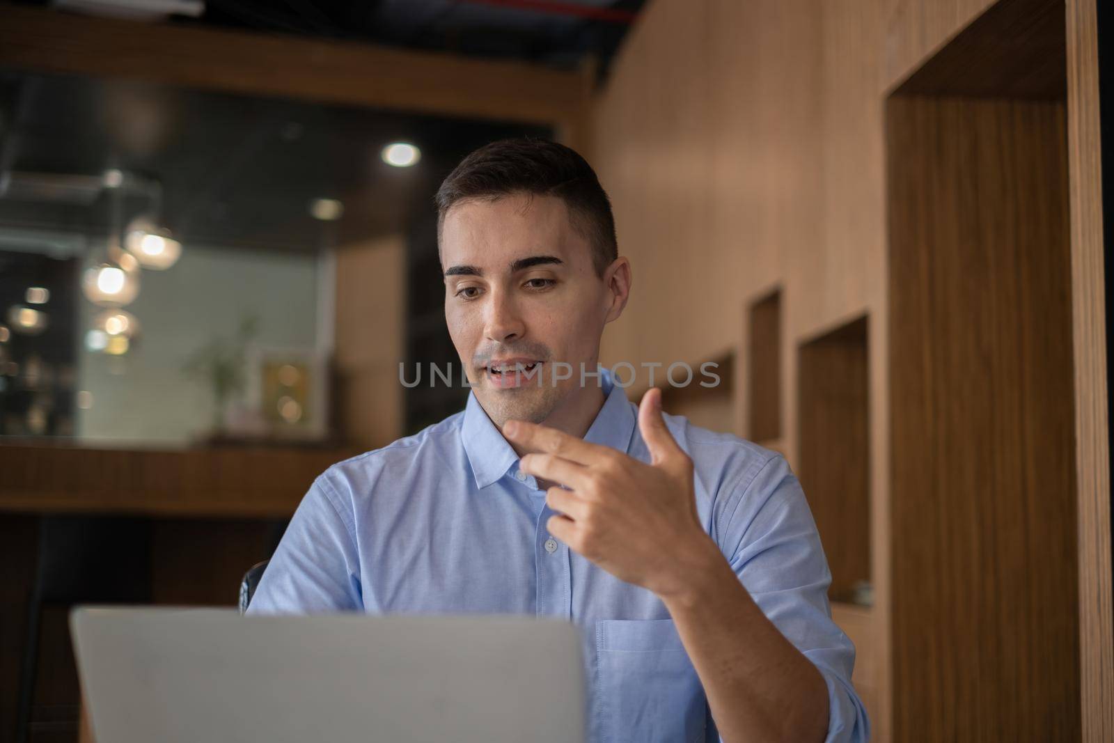 Businessman having video call brief project with his business team from home. finance concept by itchaznong