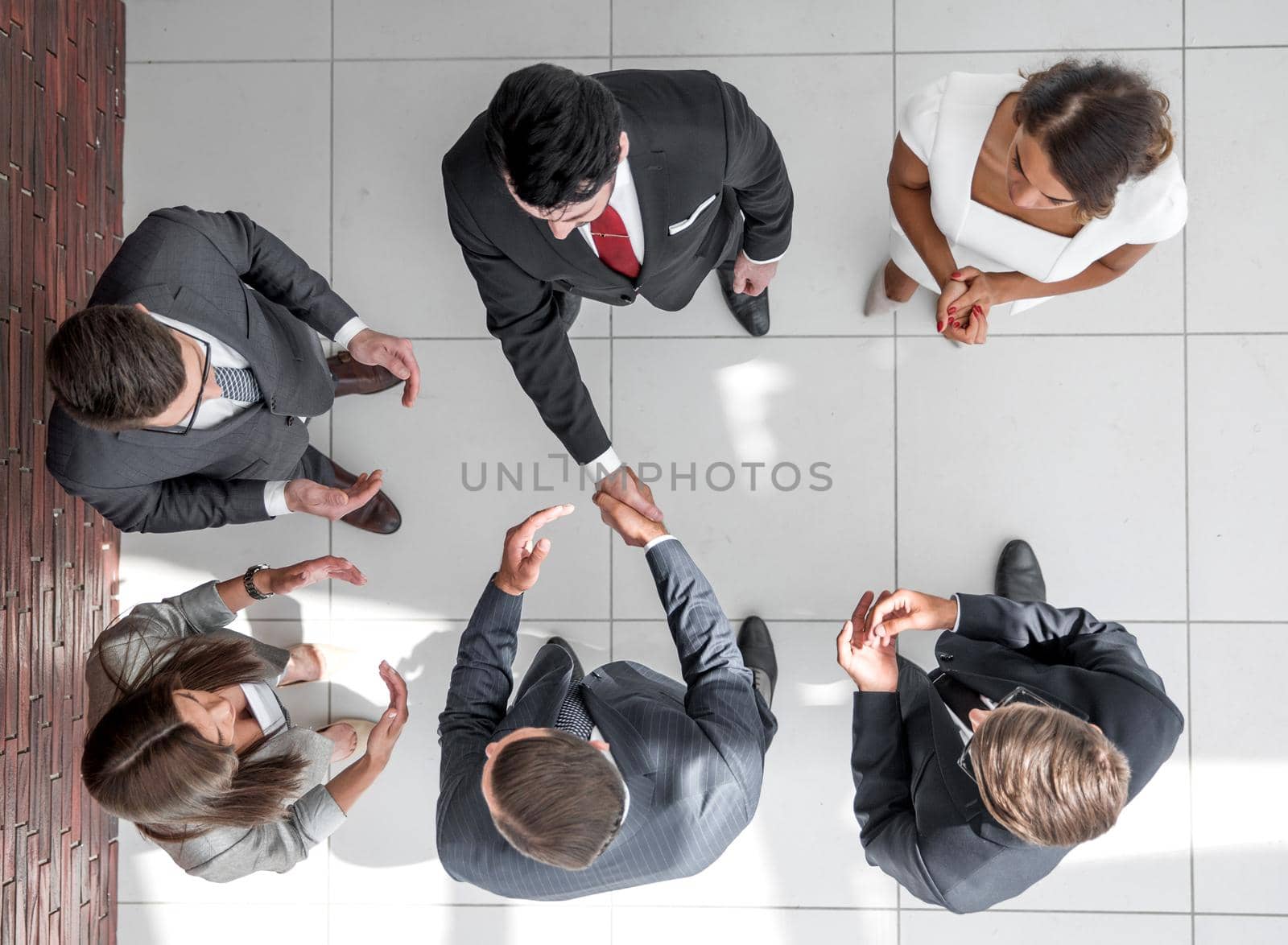 top view.business partners shaking hands.business concept