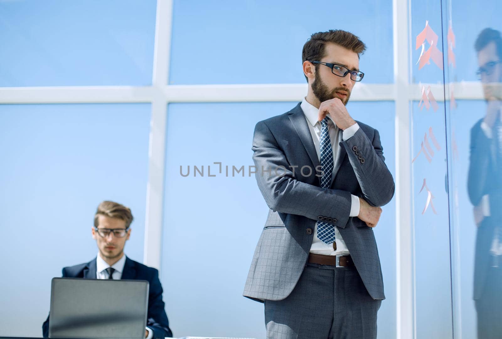 serious businessman standing in new office.photo with copy space