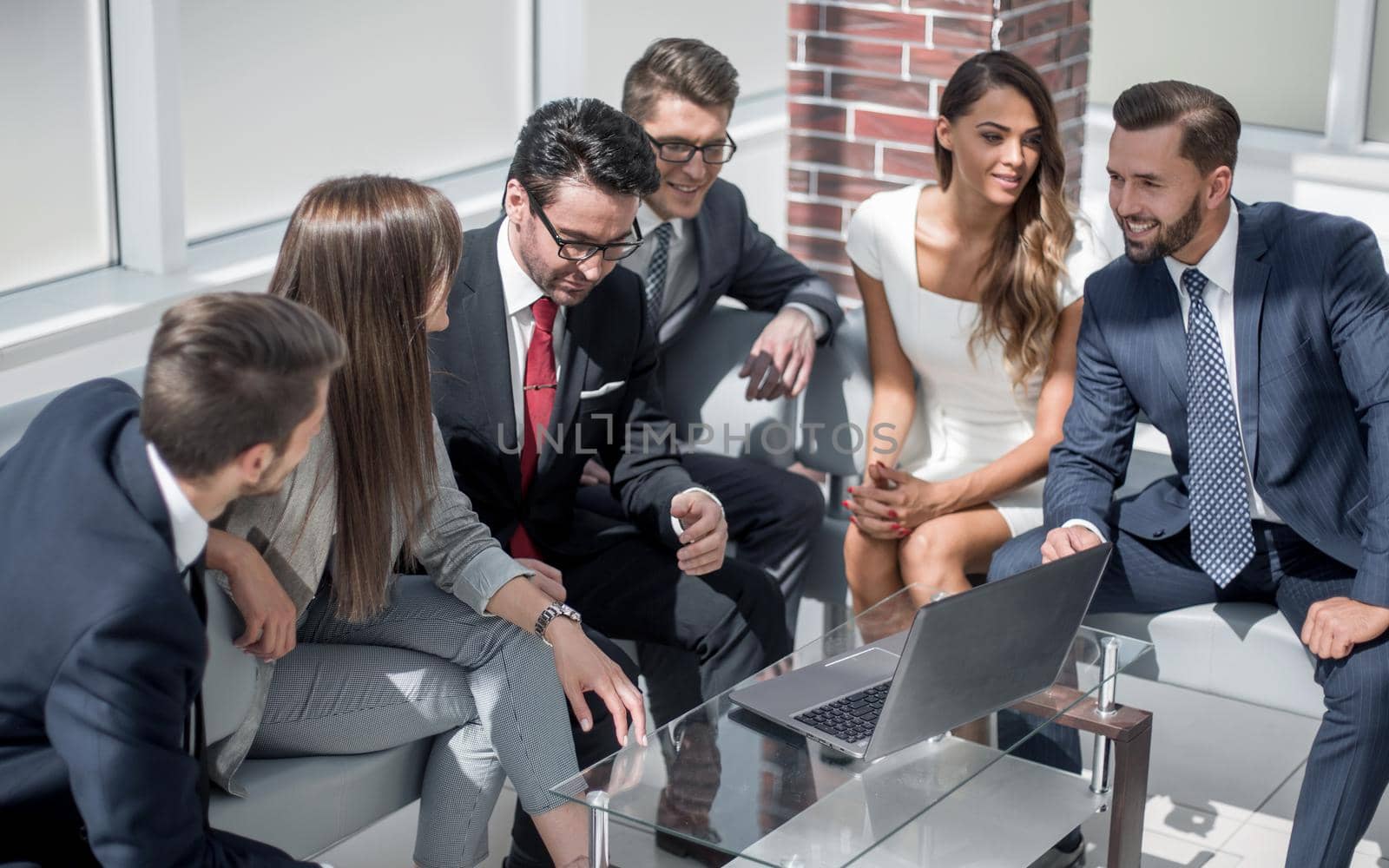 business team discussing ideas sitting in the lobby.people and technology