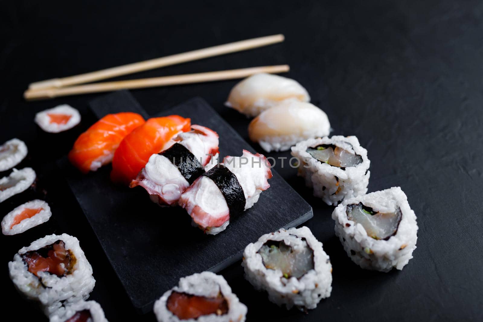 japanese sushi food. Maki ands rolls with tuna, salmon, shrimp, crab and avocado. Top view of assorted sushi